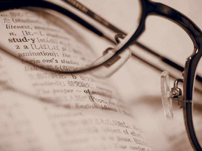 The word “Study” in the English to Japanese dictionary over the eyeglasses